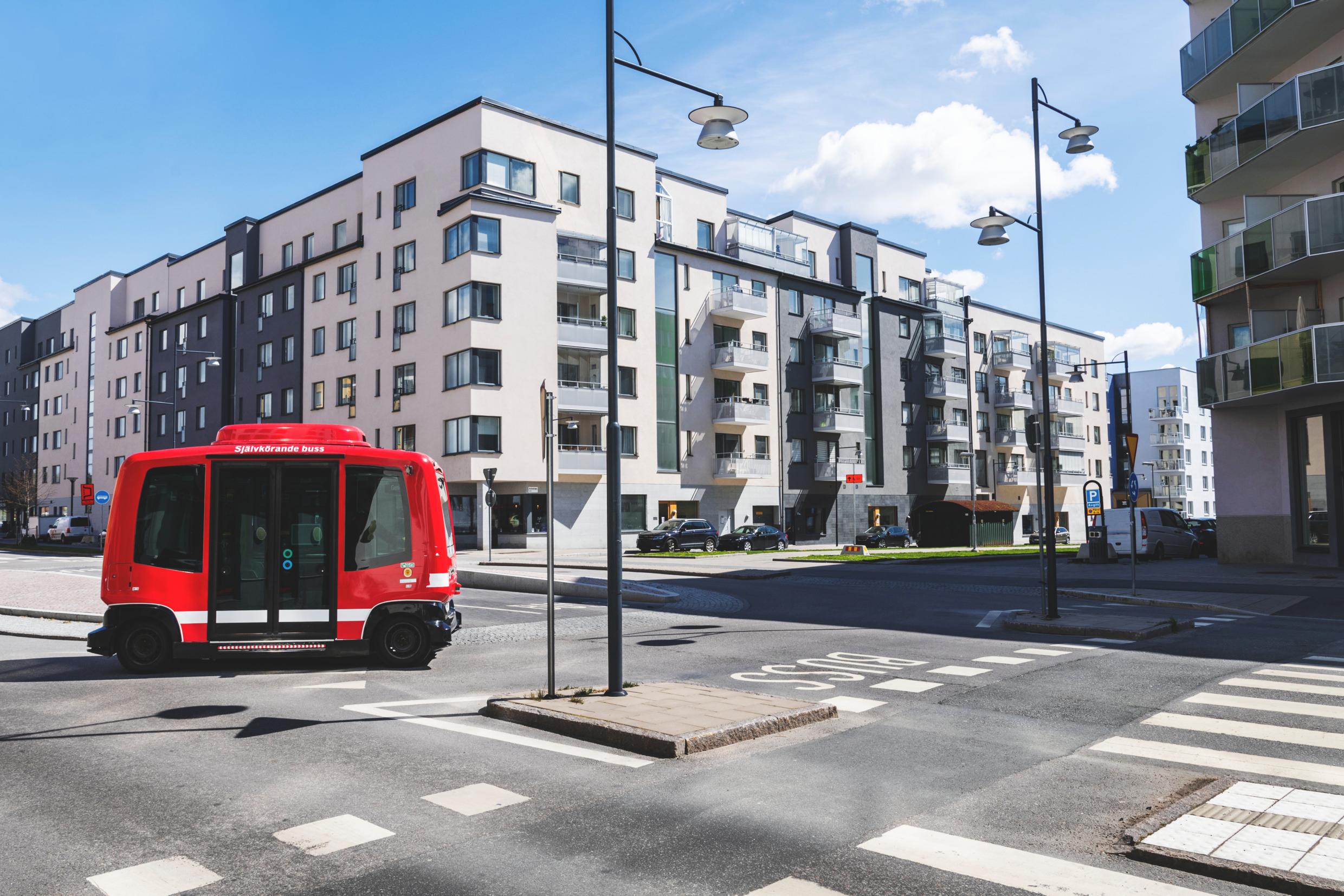 A small bus in a city setting.